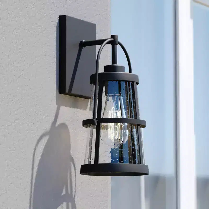 VAXCEL Portage Park 1 Light Black Dusk to Dawn Outdoor Wall Lantern Clear Glass