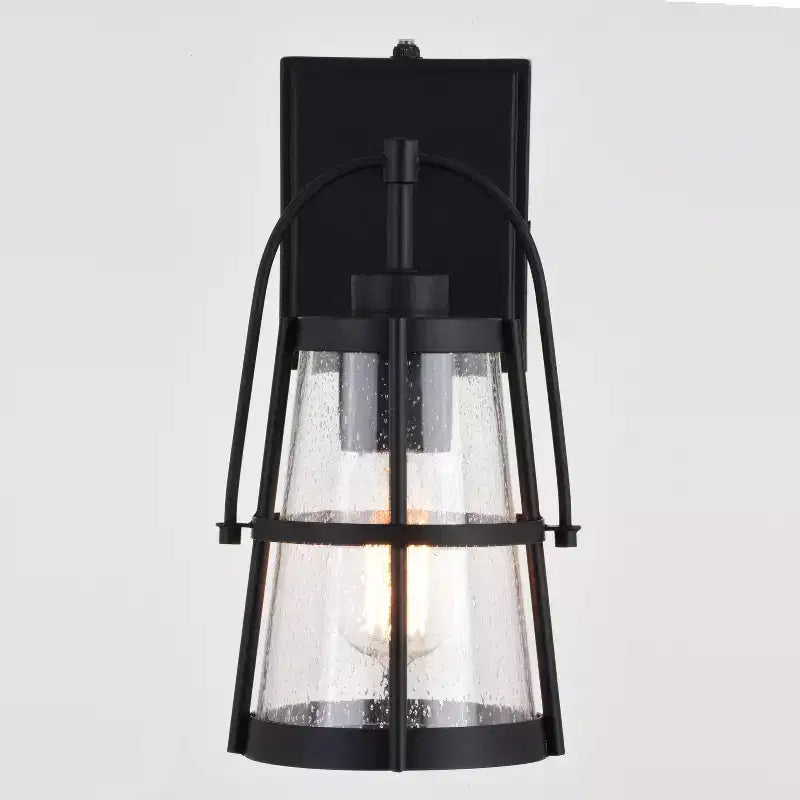 VAXCEL Portage Park 1 Light Black Dusk to Dawn Outdoor Wall Lantern Clear Glass