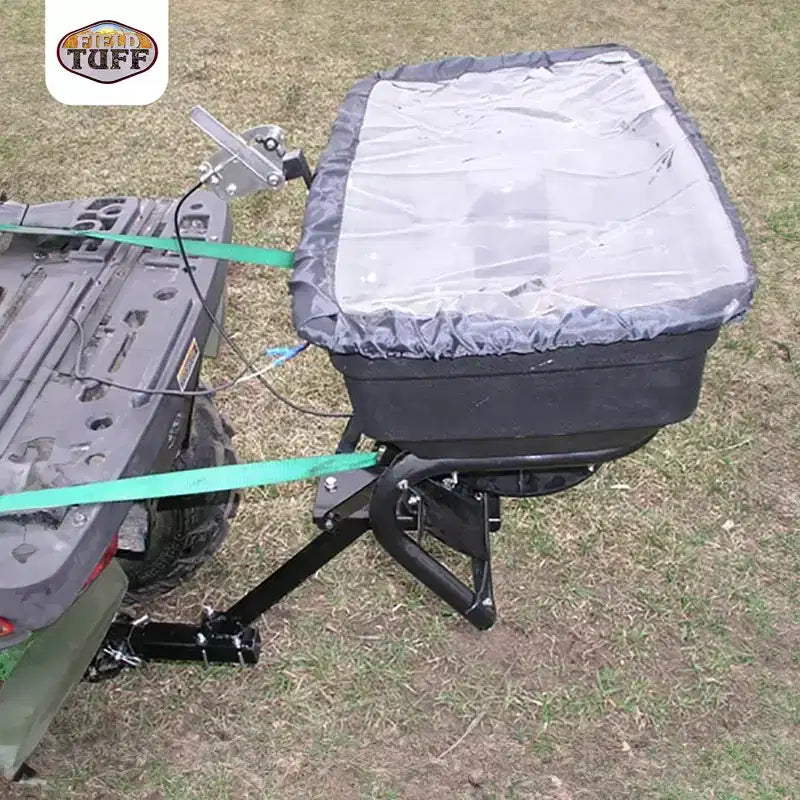 Field Tuff 12V 125 Pound Capacity Grass Seed Fertilizer Spreader with Hitch Mount Receiver and Rain Protector for ATV, UTV, or Utility Tractor